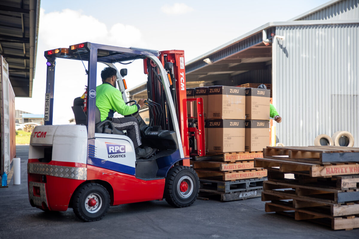 Forklift operator unloading pallets at the RPC Logistics warehouse