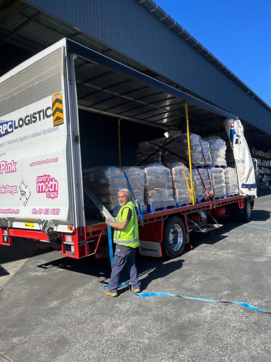 RPC Logistics team member securing pallets on a truck before delivery