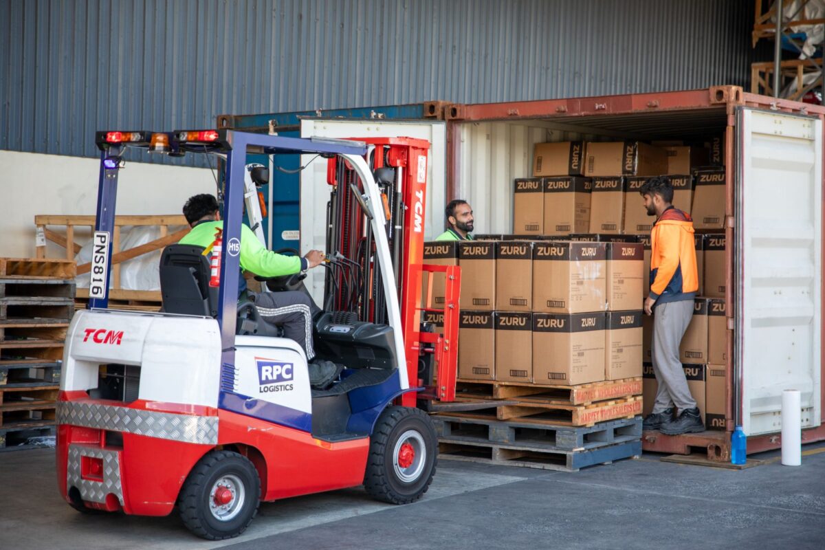 RPC Logistics team unloading stock from a container at the warehouse