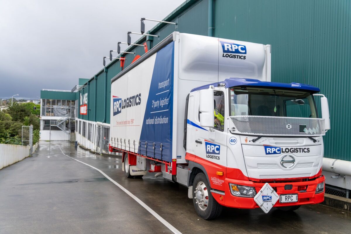 RPC Logistics truck delivering to a retail store